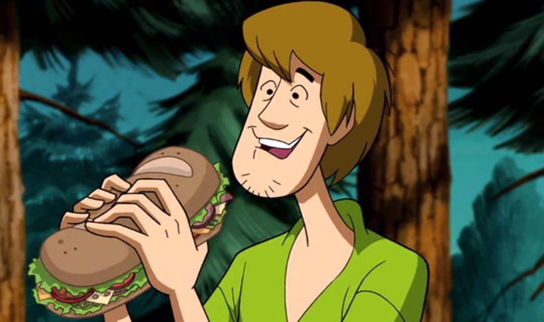 shaggy tries to avoid the munchies by eating a big sandwich